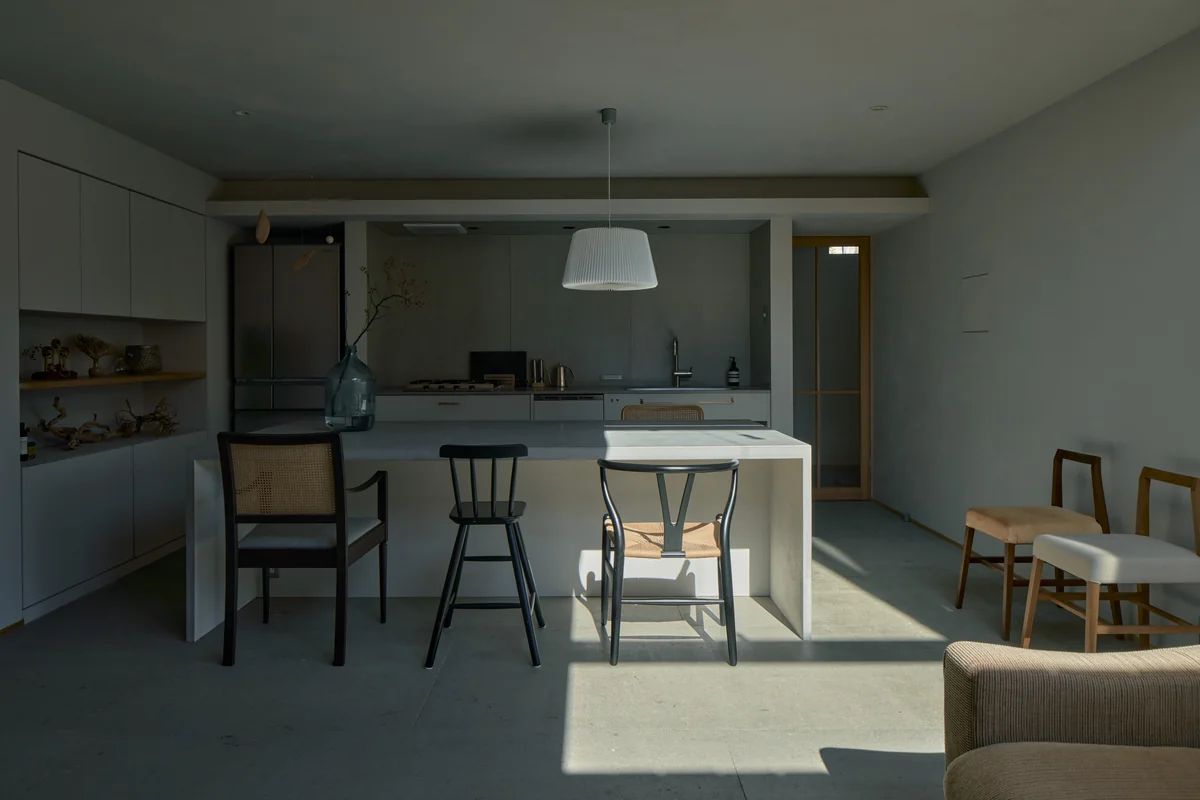 Sunlight across the table and wooden walls of the workspace